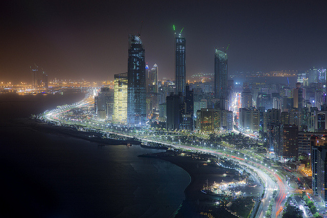Abu Dhabi skyline at night - the capital city of United Arab Emirates.